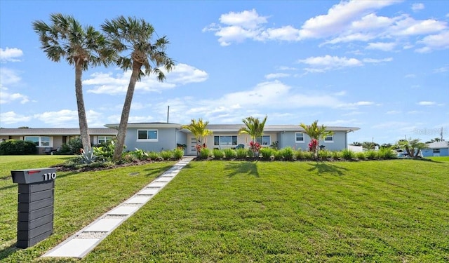 single story home featuring a front yard