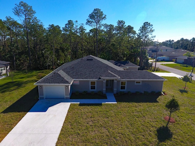 ranch-style home featuring a front lawn and a garage