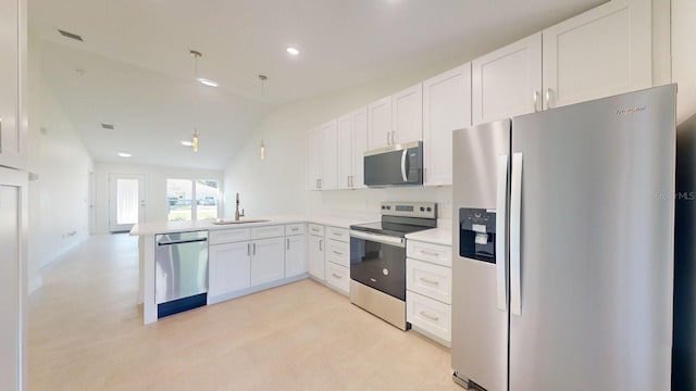 kitchen featuring kitchen peninsula, stainless steel appliances, sink, white cabinets, and lofted ceiling