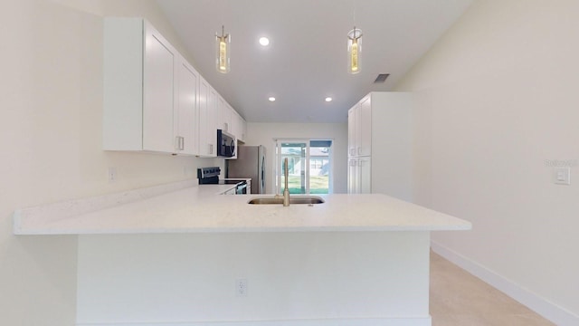 kitchen featuring pendant lighting, white cabinets, kitchen peninsula, and stainless steel appliances