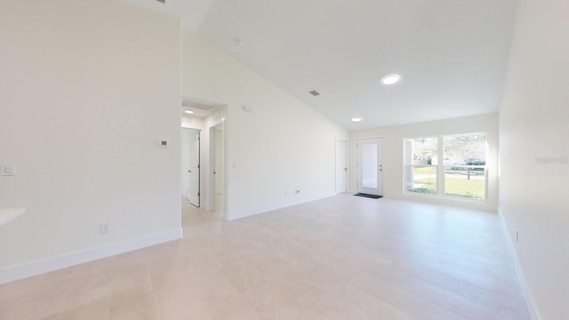 spare room with lofted ceiling