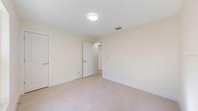 unfurnished bedroom featuring a closet