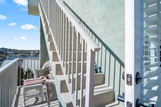 stairs with a water view