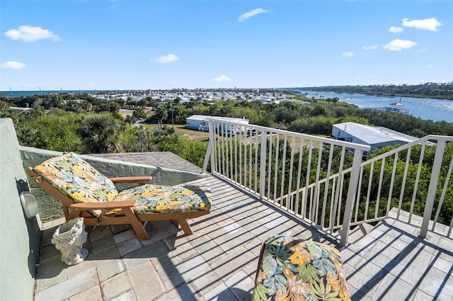 balcony featuring a water view