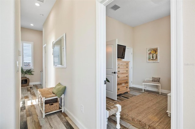 hallway featuring hardwood / wood-style flooring