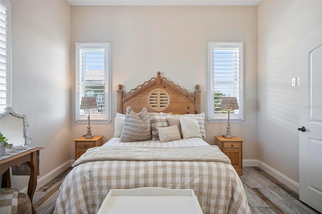 bedroom with light wood-type flooring