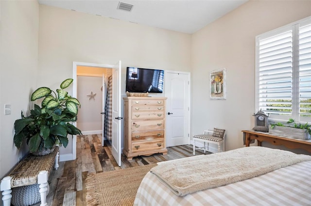 bedroom featuring dark wood-type flooring