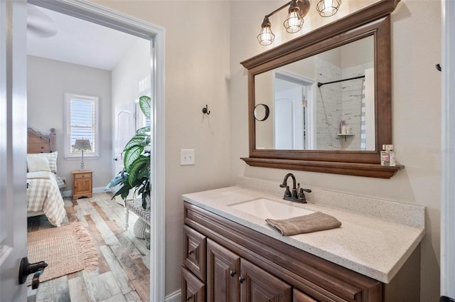 bathroom with hardwood / wood-style floors, vanity, and a shower with shower curtain