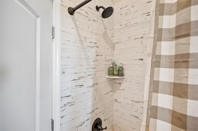 bathroom with a tile shower