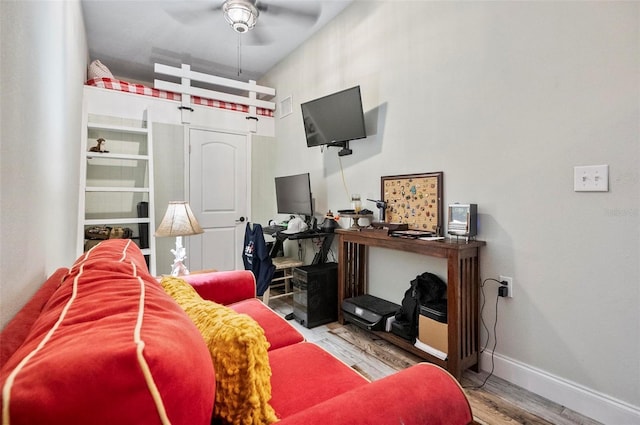 interior space with ceiling fan and hardwood / wood-style floors