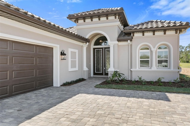 doorway to property featuring a garage