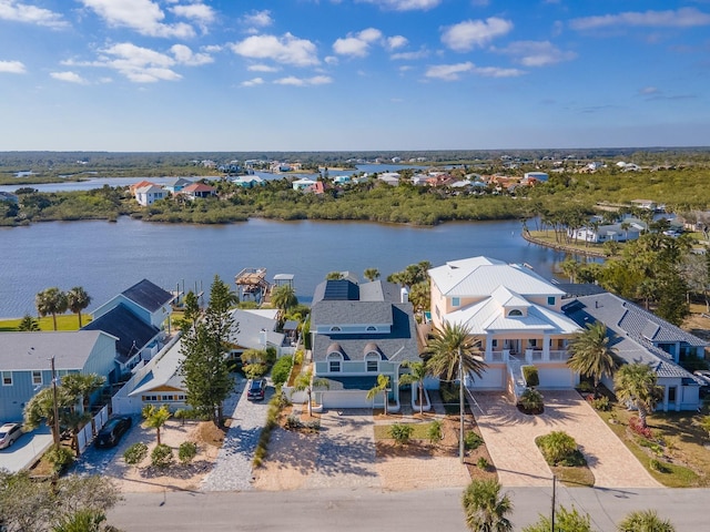 birds eye view of property with a residential view and a water view