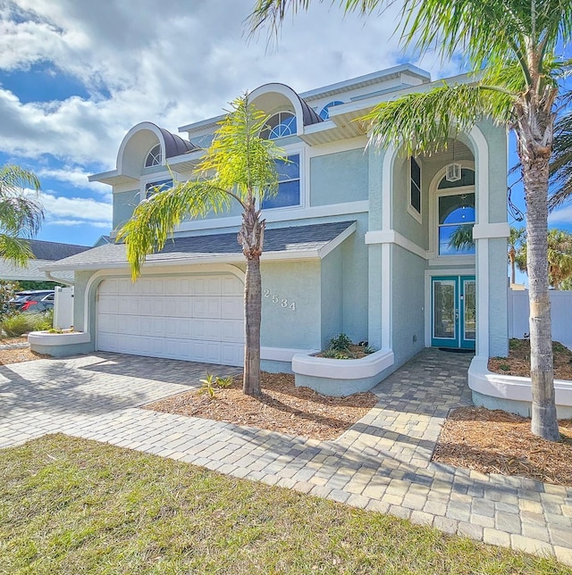 view of front facade with french doors and a garage