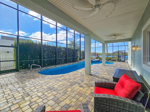 view of pool featuring ceiling fan and a patio area