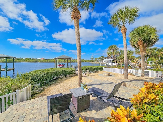 view of patio with a water view