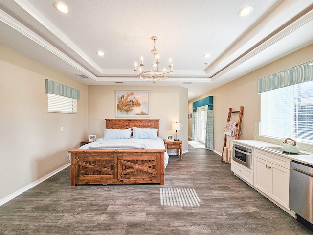 bedroom with a raised ceiling, a chandelier, and dark wood-type flooring