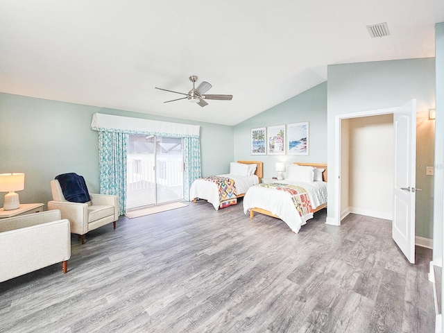 bedroom featuring access to outside, ceiling fan, hardwood / wood-style floors, and lofted ceiling