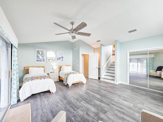 bedroom featuring access to outside, ceiling fan, dark wood-type flooring, and lofted ceiling