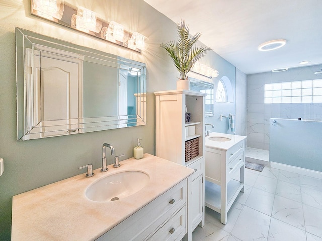 bathroom with vanity and tiled shower