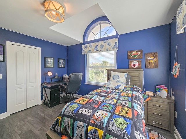 bedroom featuring a closet and dark hardwood / wood-style floors