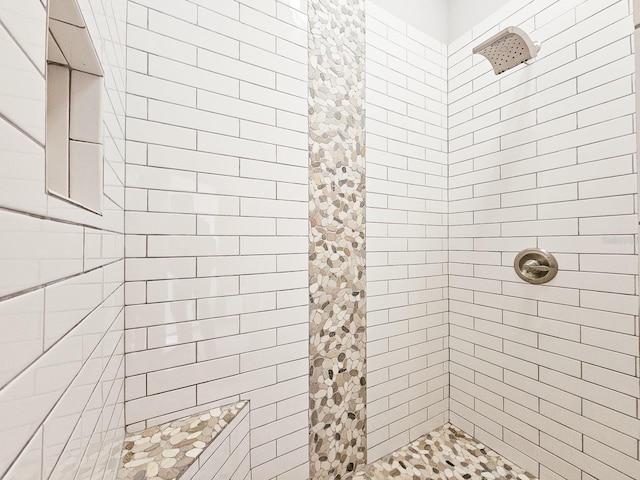 bathroom featuring tiled shower