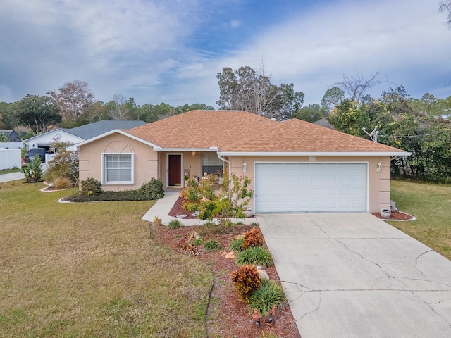 ranch-style home featuring a front lawn and a garage