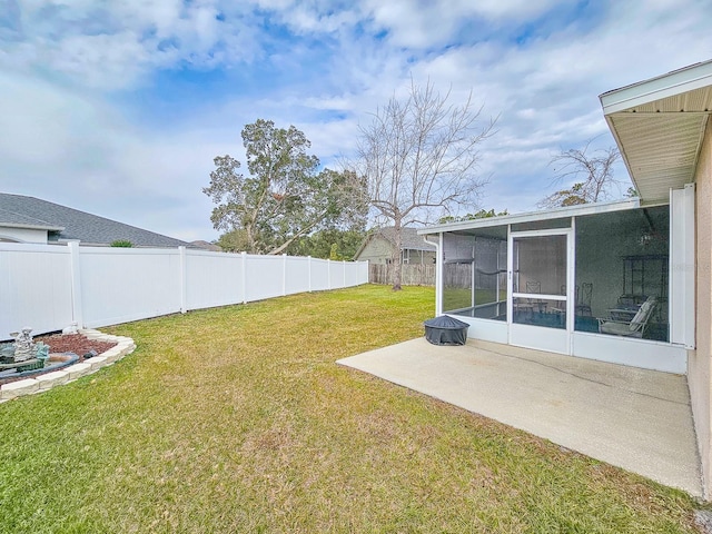 view of yard featuring a patio and a sunroom