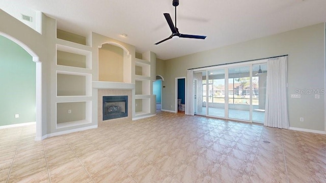 unfurnished living room with ceiling fan and built in features