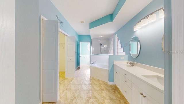 bathroom with a healthy amount of sunlight, vanity, and independent shower and bath