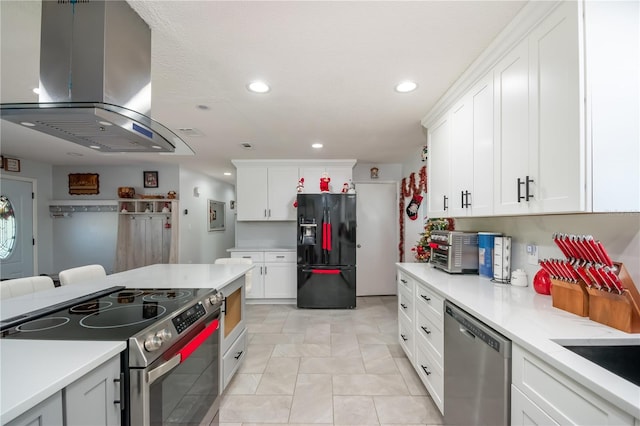 kitchen with white cabinetry, island range hood, and appliances with stainless steel finishes