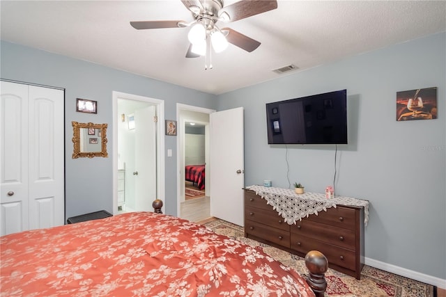 bedroom with ceiling fan and a closet