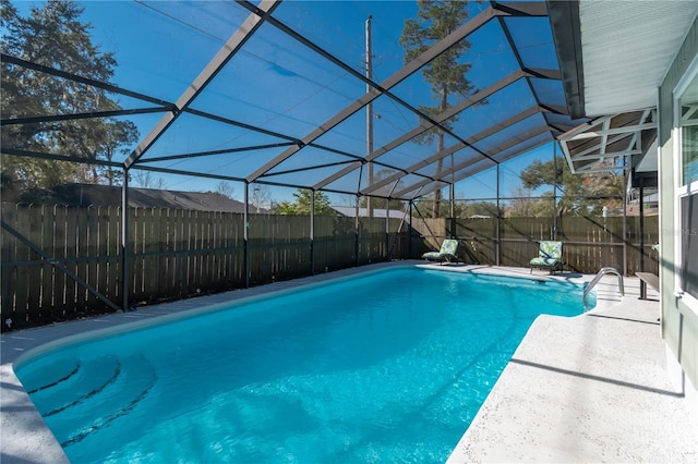 view of pool featuring a lanai and a patio area