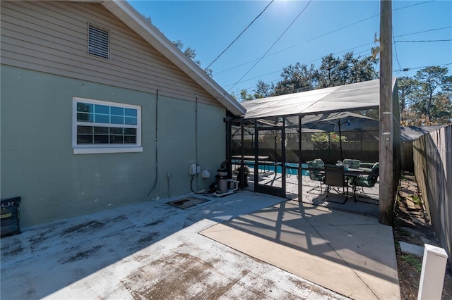 view of patio / terrace featuring a fenced in pool and a lanai