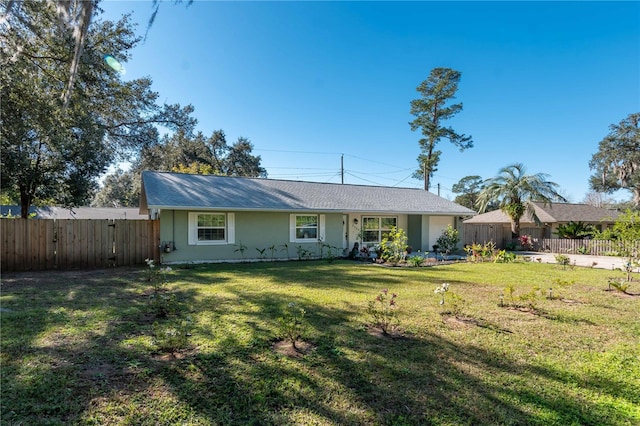 ranch-style home with a front yard