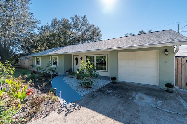 single story home featuring a garage