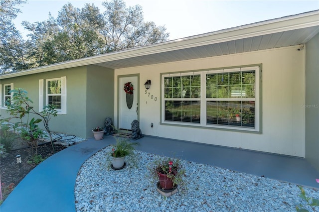 5700 E Fort King St, Ocala, FL 34470 - view of front facade with covered porch and stucco siding