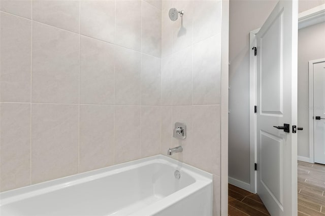 75 Randolph Dr, Palm Coast, FL 32164 - full bathroom with shower / bathtub combination, baseboards, and wood tiled floor