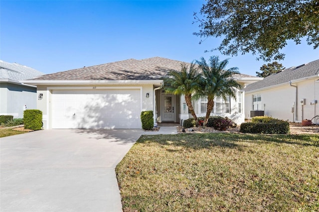 ranch-style house with cooling unit, a garage, and a front yard