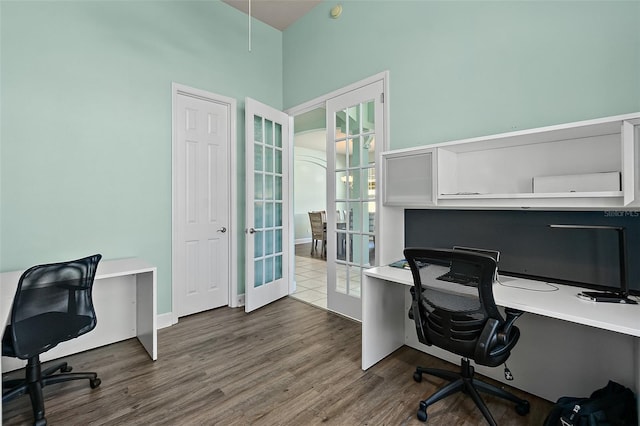 office space with french doors and hardwood / wood-style floors