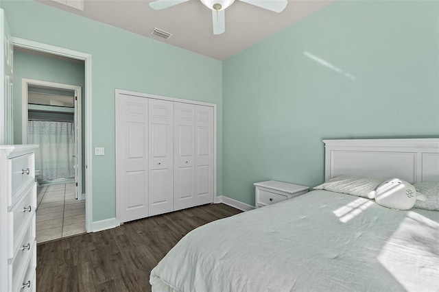 bedroom with ceiling fan, dark hardwood / wood-style flooring, and a closet