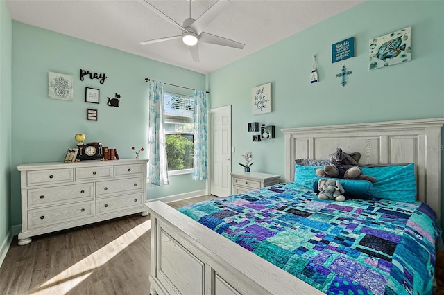 bedroom with light wood-type flooring and ceiling fan