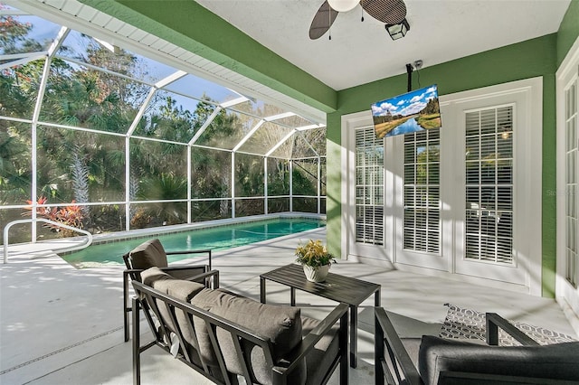 view of patio / terrace featuring a lanai and ceiling fan