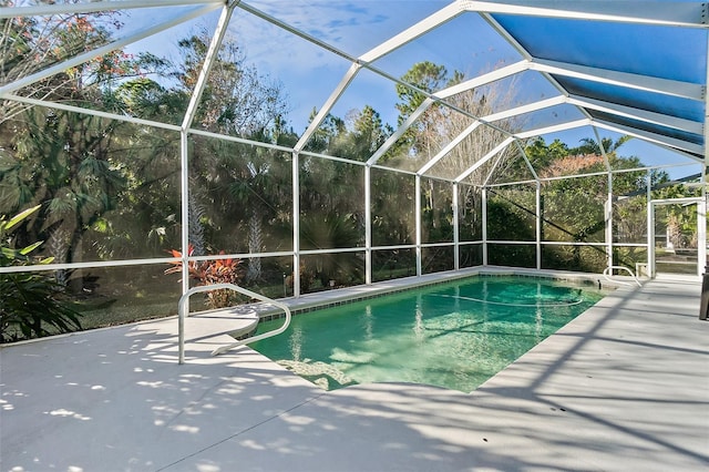 view of pool featuring a lanai and a patio area