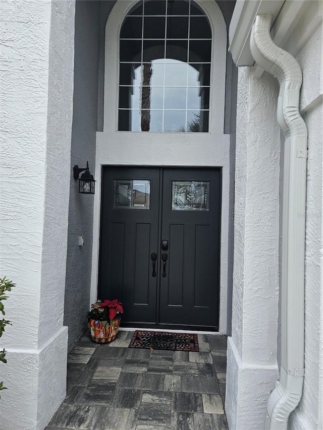 entrance to property featuring french doors