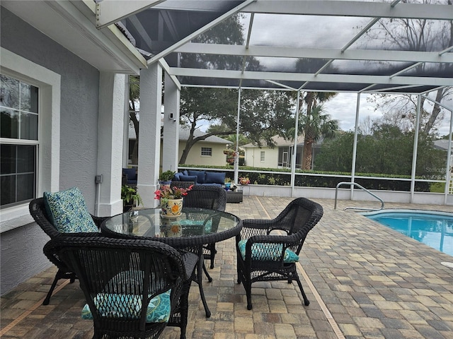 exterior space with an outdoor hangout area and glass enclosure