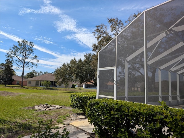 view of yard with glass enclosure