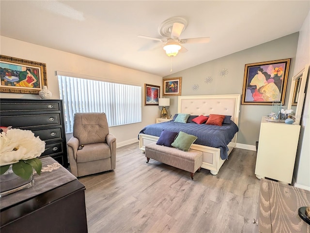 bedroom featuring lofted ceiling, ceiling fan, light wood-type flooring, and baseboards