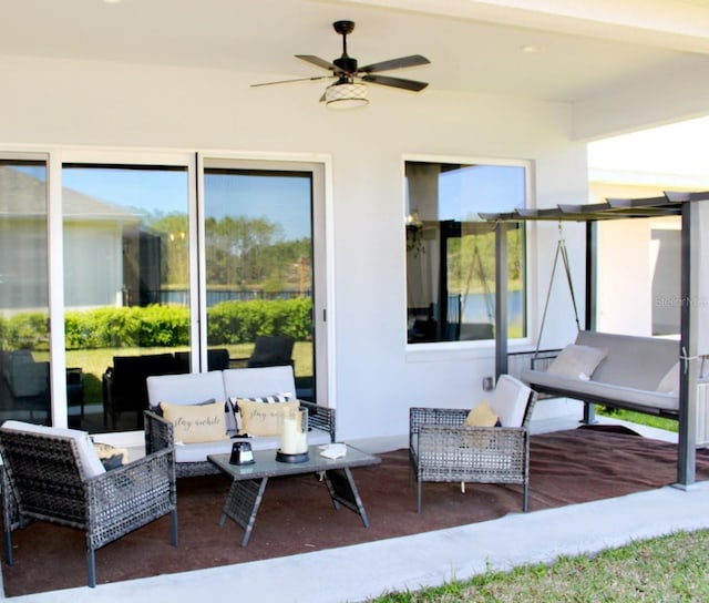 view of patio featuring outdoor lounge area and ceiling fan