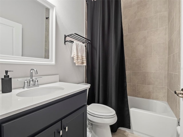 full bathroom featuring toilet, vanity, and shower / tub combo