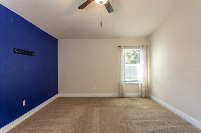 spare room with ceiling fan and carpet flooring